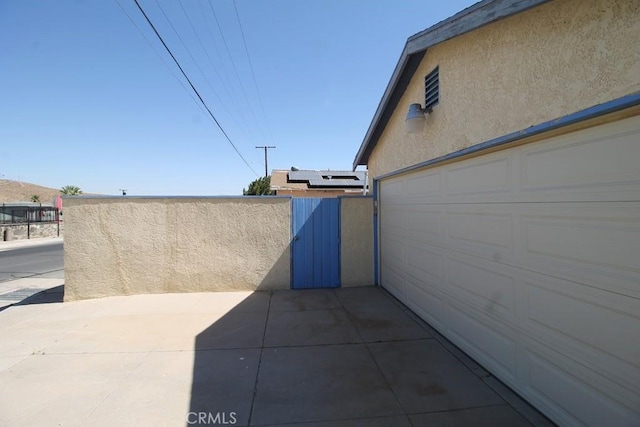 view of patio with a garage