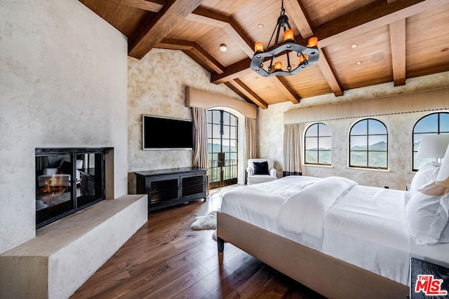 bedroom featuring wooden ceiling, dark hardwood / wood-style floors, a notable chandelier, and lofted ceiling with beams