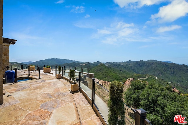 view of terrace featuring a mountain view