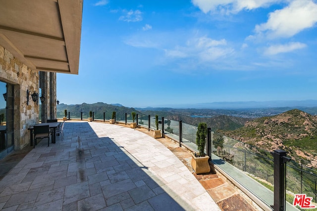 view of patio / terrace featuring a mountain view