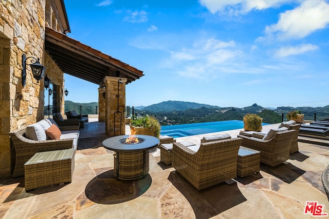 view of terrace with outdoor lounge area and a mountain view