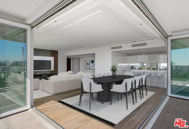 dining space featuring hardwood / wood-style flooring