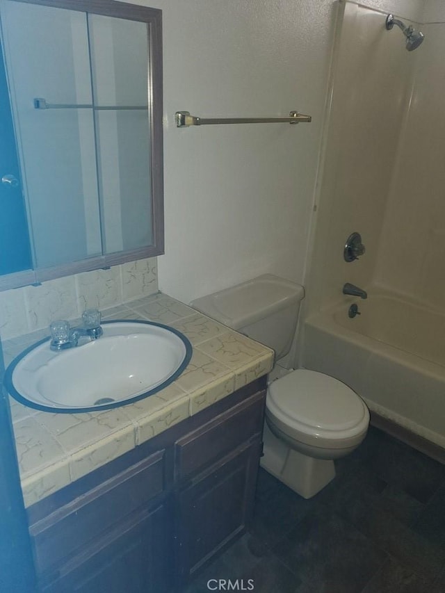 full bathroom with vanity, toilet, and shower / washtub combination