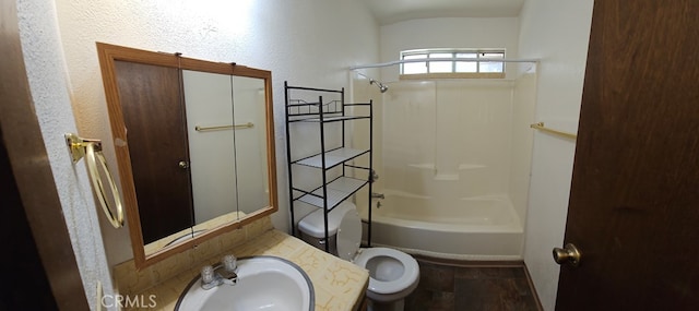 full bathroom featuring toilet, shower / bathtub combination, and sink