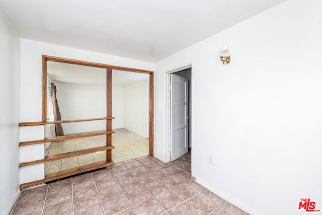 view of tiled spare room