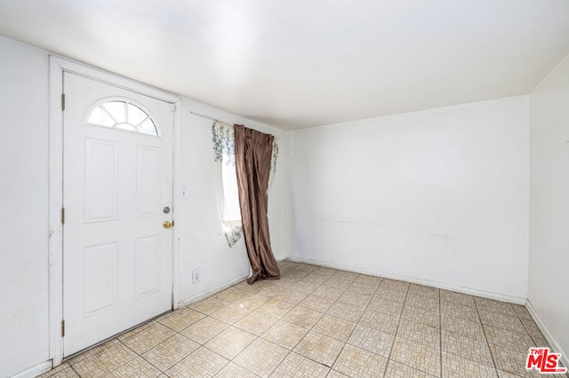 foyer with light tile floors