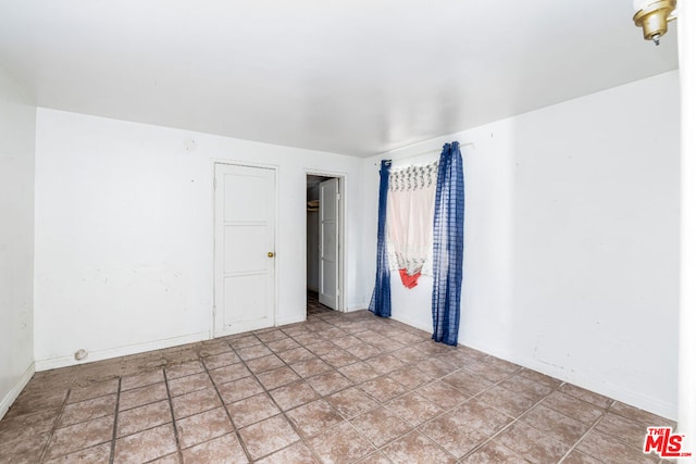 empty room featuring light tile floors