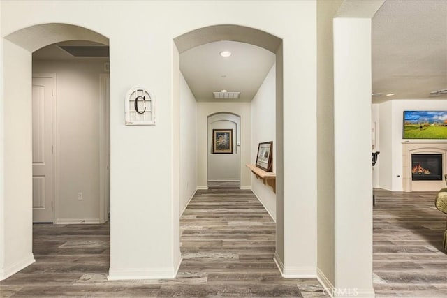 hall with dark hardwood / wood-style flooring