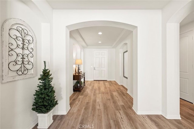 hallway with light hardwood / wood-style flooring