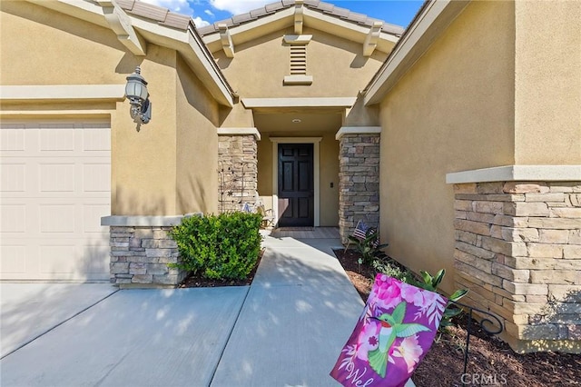 doorway to property featuring a garage