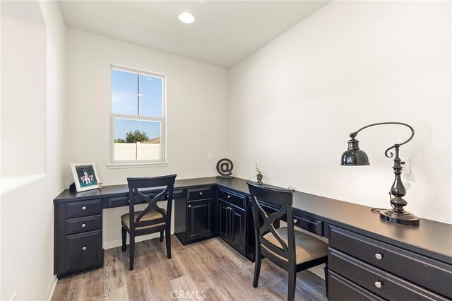 office space with light hardwood / wood-style flooring