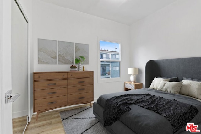 bedroom with light wood-type flooring