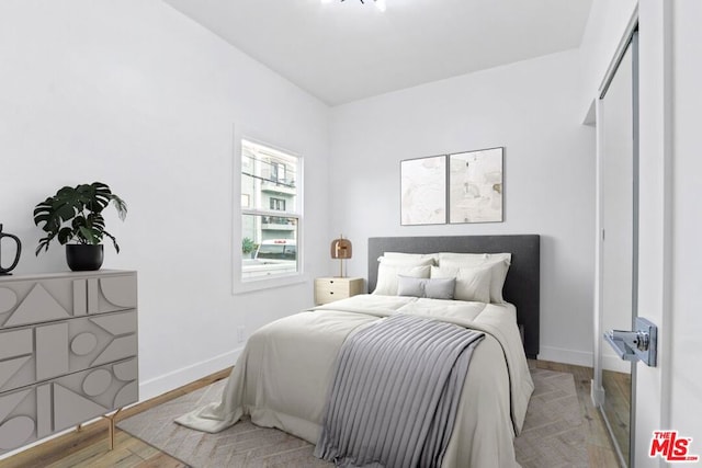 bedroom featuring hardwood / wood-style floors