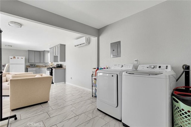 clothes washing area with separate washer and dryer, electric panel, and a wall mounted AC