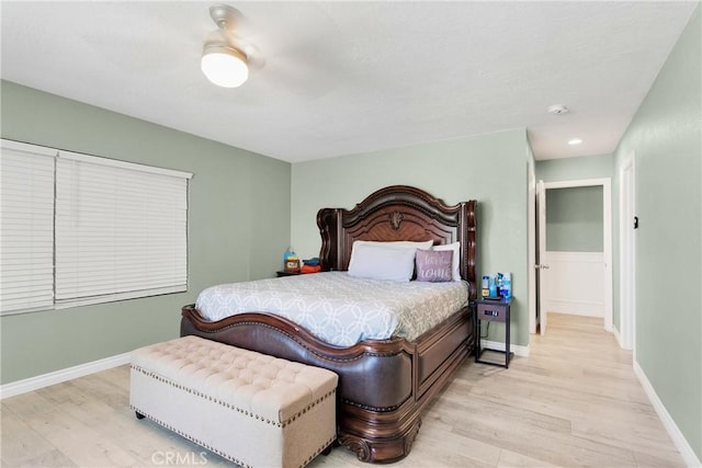 bedroom with ceiling fan and light wood-type flooring