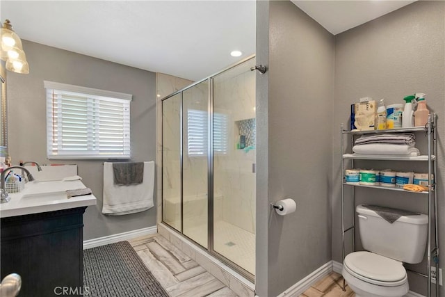 bathroom featuring vanity, toilet, and walk in shower