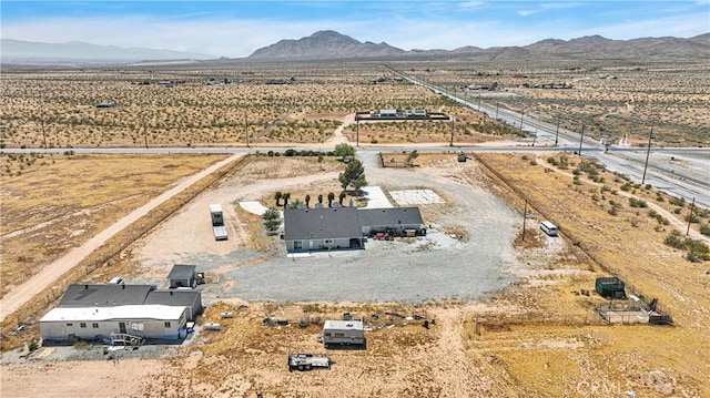 birds eye view of property featuring a mountain view