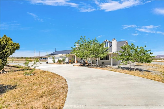 view of front of house featuring solar panels