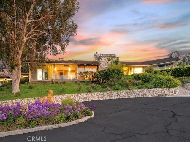 ranch-style house with a yard