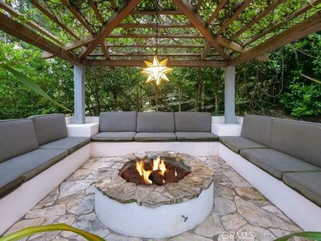 view of patio / terrace featuring an outdoor living space with a fire pit