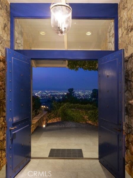 doorway featuring tile patterned flooring