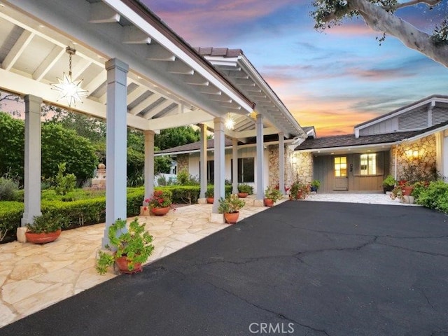 view of patio terrace at dusk