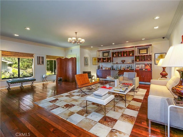 living room with billiards, ornamental molding, a chandelier, and hardwood / wood-style floors