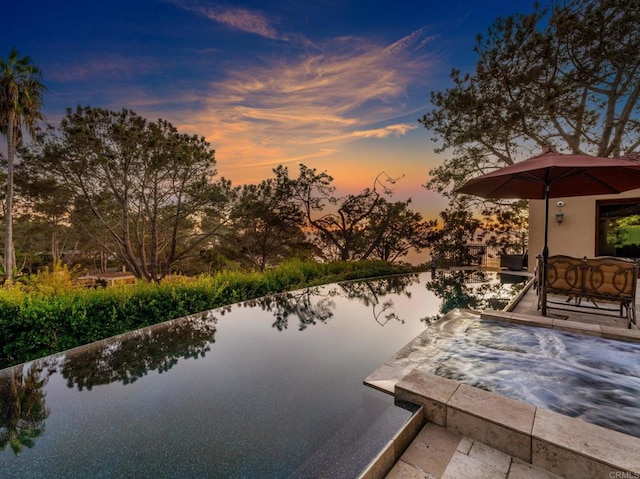 view of patio terrace at dusk