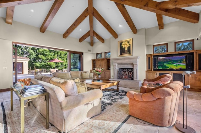 living room with beam ceiling and high vaulted ceiling