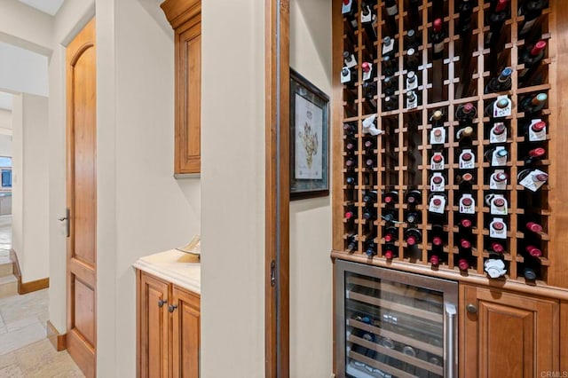 wine cellar featuring bar and wine cooler