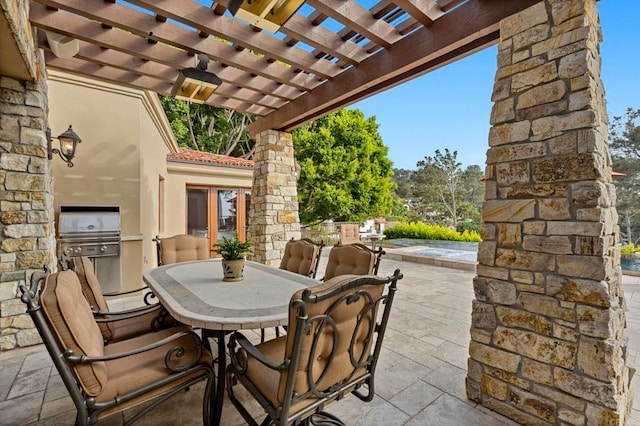 view of patio / terrace with a pergola and area for grilling