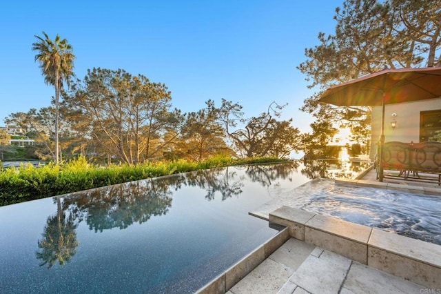 exterior space with a patio and a water view