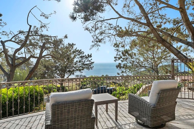 wooden deck featuring a water view