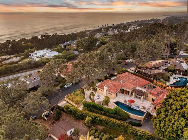 aerial view at dusk with a water view