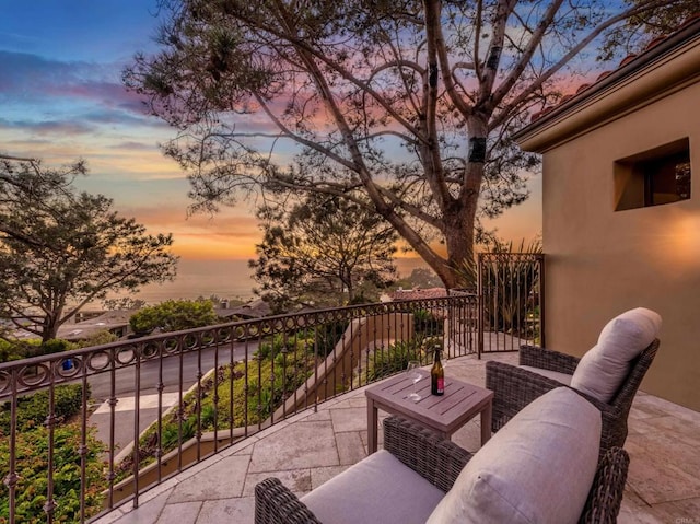 view of balcony at dusk