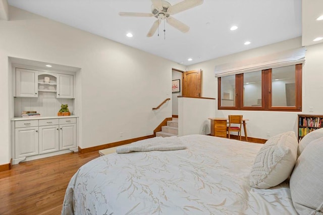 bedroom featuring light hardwood / wood-style floors and ceiling fan