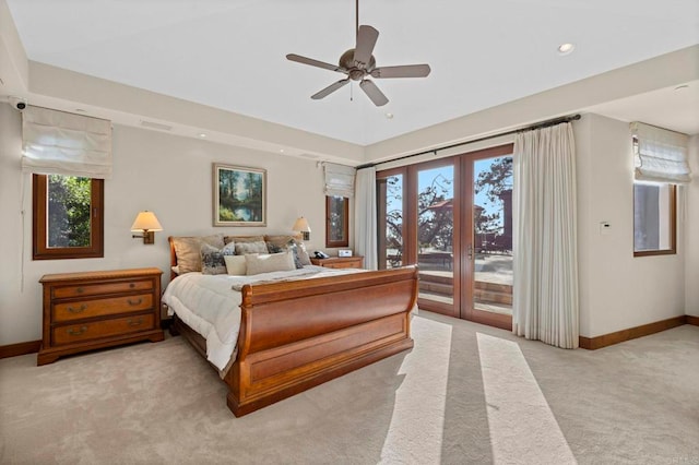 bedroom featuring access to exterior, light colored carpet, and ceiling fan