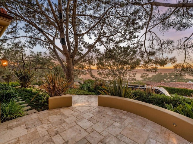 view of patio terrace at dusk