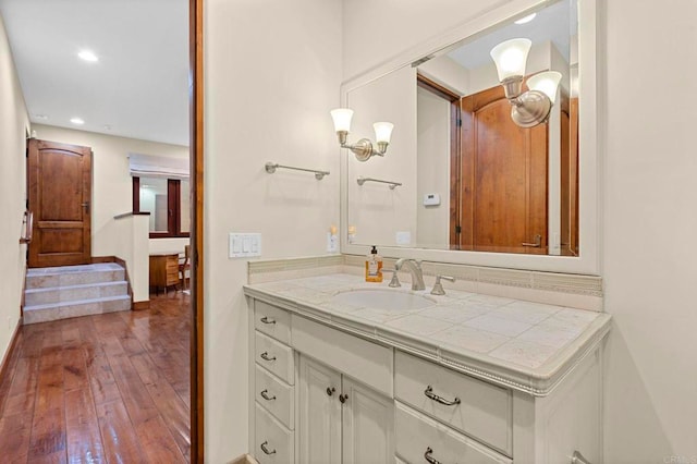 bathroom with vanity and hardwood / wood-style flooring