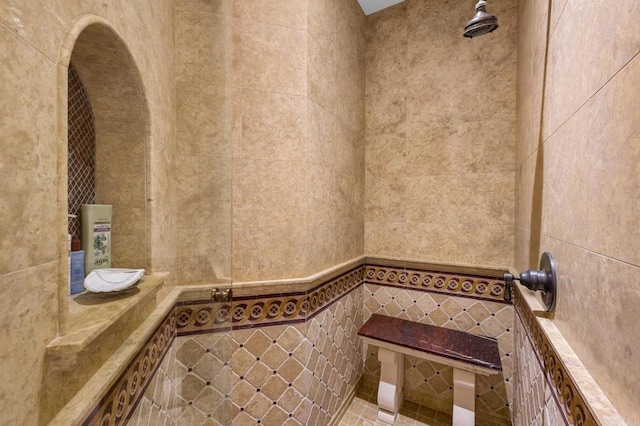 bathroom with tile walls