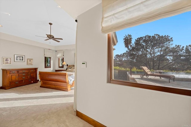 carpeted bedroom with lofted ceiling