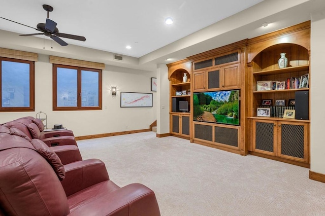 living room featuring light carpet and ceiling fan