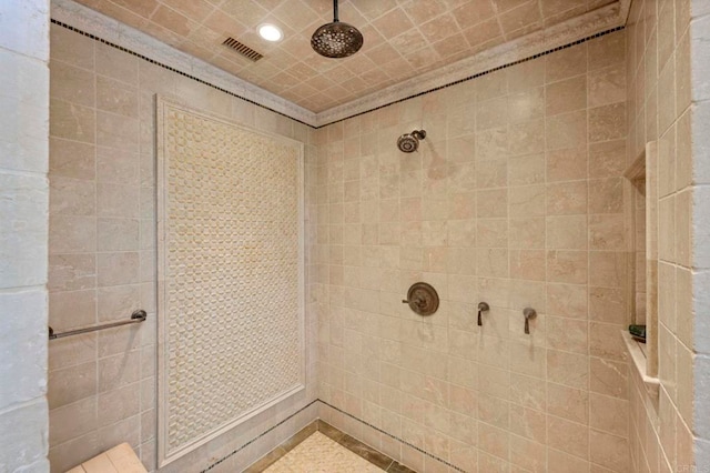 bathroom with a tile shower