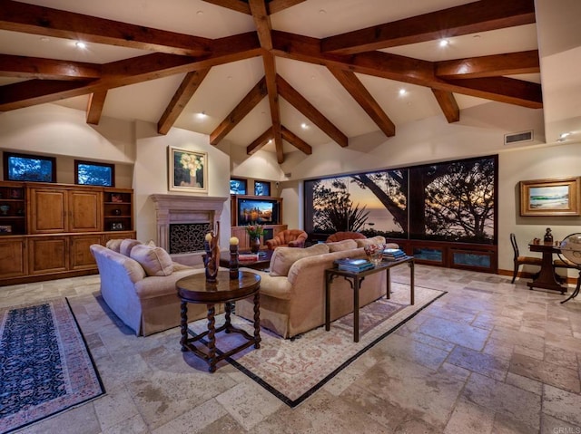 living room with beam ceiling and high vaulted ceiling