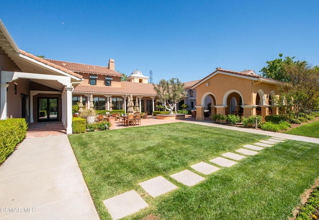 exterior space featuring a patio area and a front yard