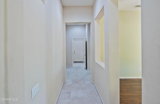 hall featuring light tile floors