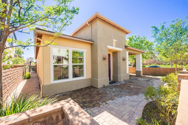 back of house featuring a patio