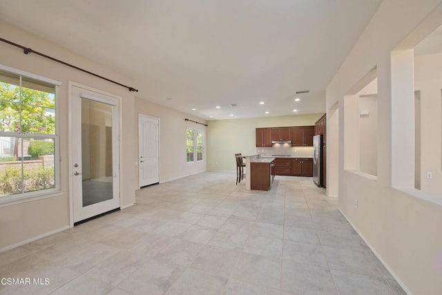 interior space featuring a wealth of natural light and light tile floors