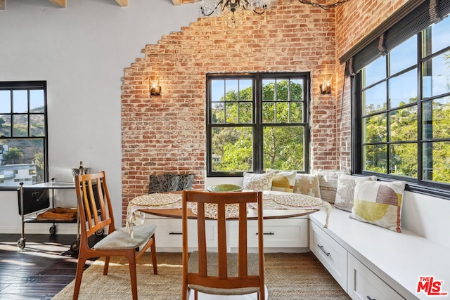 dining area featuring a wealth of natural light and hardwood / wood-style flooring