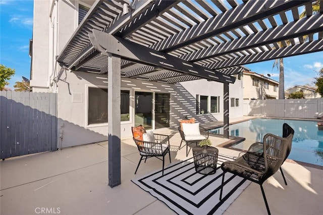 view of patio / terrace with a fenced in pool and a pergola